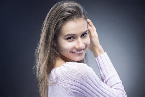 natural portrait of sensual smiling caucasian brunette woman with beautiful long hair stock