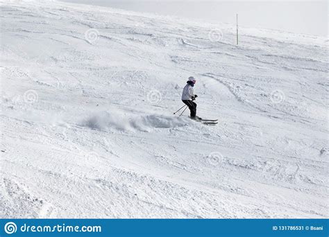 Skier Downhill On Snowy Ski Slope At Suny Winter Day Editorial Photo