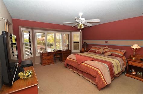 41 lively ways to use the color red. Southwestern bedroom paint color red-orange | Southwestern ...