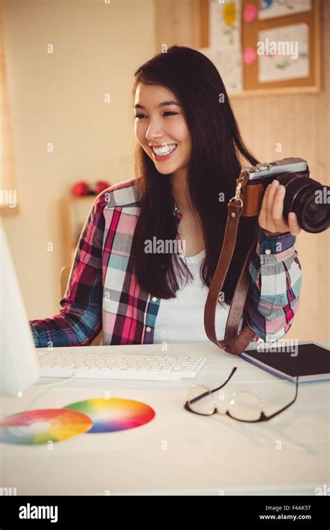 Happy Photographer Holding Her Camera Stock Photo Alamy