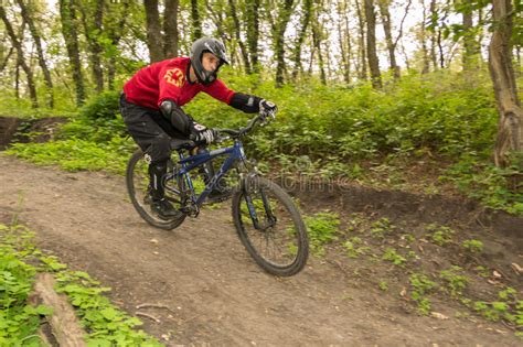 Man Riding A Mountain Bike Downhill Style Editorial Photography Image Of Exercise Caucasian