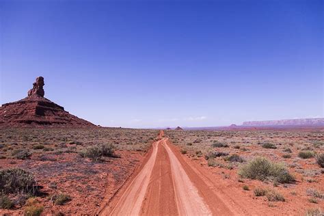 Brown Soil Road Under Clear Sky Arid Barren Blue Sky Canyon Clear