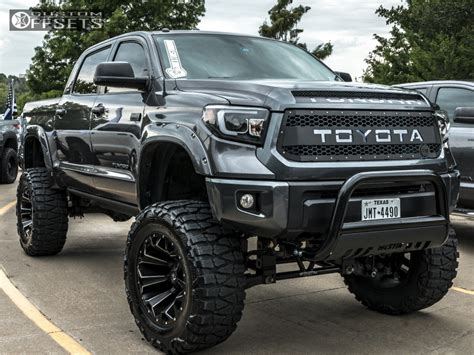 Lifted Red Toyota Tundra With Black Rims