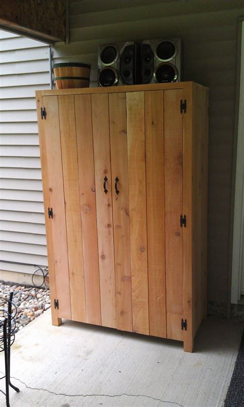 Fantastic Outdoor Cedar Storage Cabinet With Black Butterfly Hinges And