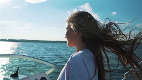 A Woman Is Driving Boat Hair In Wind Stock Footage Sbv
