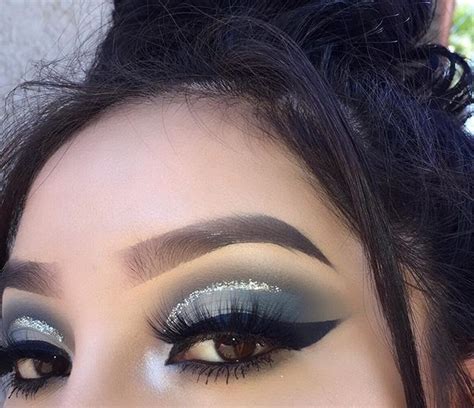 Call me crazy brow lady! Metallic ice blue eyeshadow look with gold glitter ...