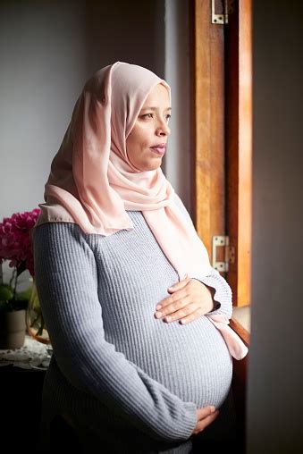 Muslim Pregnant Woman And Pregnancy With Mother And Health Prenatal Care With Window View