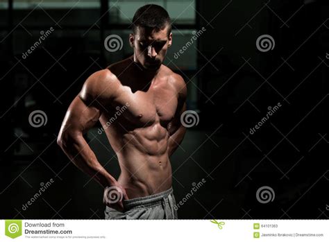 Man In Gym Showing His Well Trained Body Stock Image Image Of Flexing