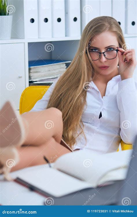 Office Flirt Attractive Woman Flirting Over Desk With Her Coworker Or Boss Stock Image