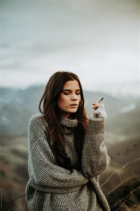 Woman Smoking Marihuana At Mountain By Stocksy Contributor Javier
