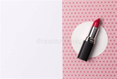 Bright Red Lipstick On Creative Polka Dot Pink Background With Copy