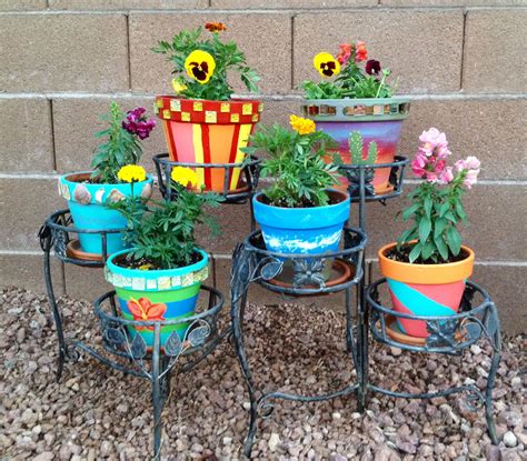 Check out our terracotta pot paint selection for the very best in unique or custom, handmade pieces from our planters & pots shops. My painted terra cotta pots filled with flowers | Painted ...