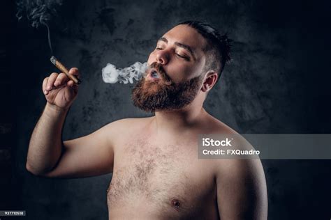 Bearded Male Smoking A Cigarette Stock Photo Download Image Now