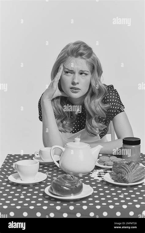Retro Blond Monochrome Portrait Of Young Beautifl Girl Sitting At The Table Concept Of Beauty