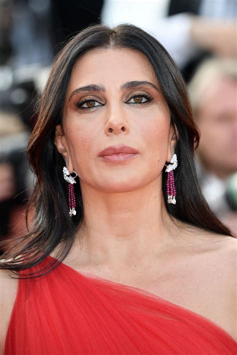 Nadine is a socially intelligent robot which returns a greeting, makes eye contact, and can remember all the conversations had with it. NADINE LABAKI at 72nd Annual Cannes Film Festival Closing ...