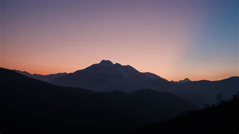 Download Wallpaper 2560x1440 Mountains Sunset Clean Skyline Mist