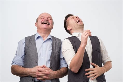 Premium Photo Two Young And Old Men Laughing