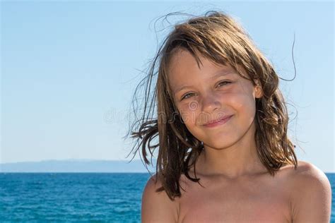 A Beautiful Girl Posing On A Beach By The Sea Stock Image Image Of