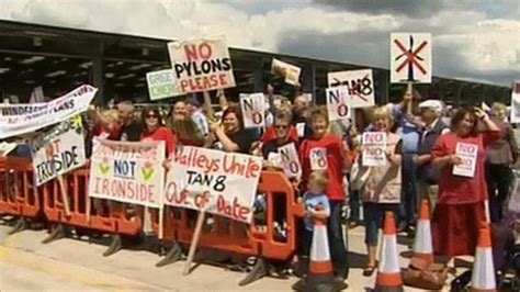 1 500 protest as powys council urges wind farm review bbc news
