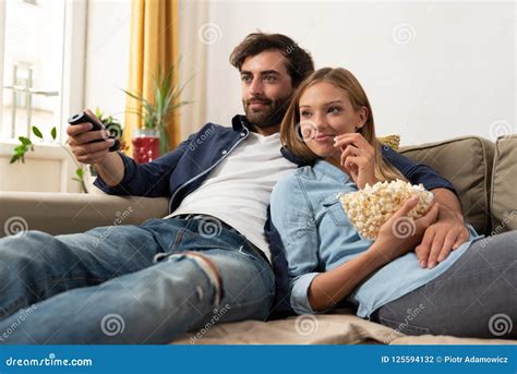 Couple Watching Tv On A Sofa At Home Stock Photo Image Of Series