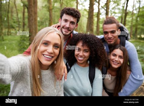 Multi Ethnic Group Of Five Young Adult Friends Taking A Selfie In A