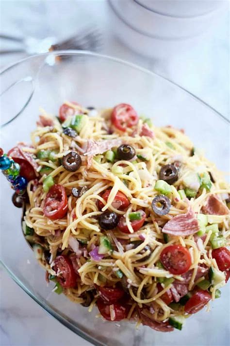 It's fresh, tasty, zesty, and perfect for summer. Summer Italian Spaghetti Salad Recipe - Reluctant Entertainer