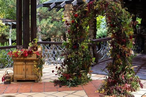 Grapevine Wedding Arch With Interwoven Roses Carnations Celosia