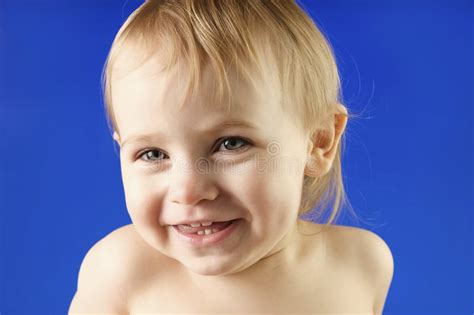 Close Up Of Baby Child Face On Studio Background Baby Girl Positive