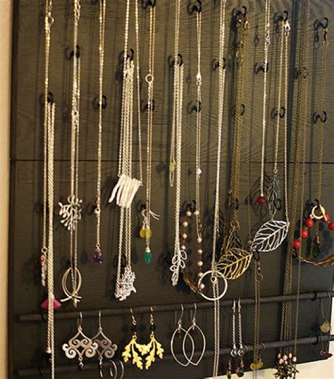 Use Hooks On A Wooden Board And Hand Your Necklaces And Earring Neatly