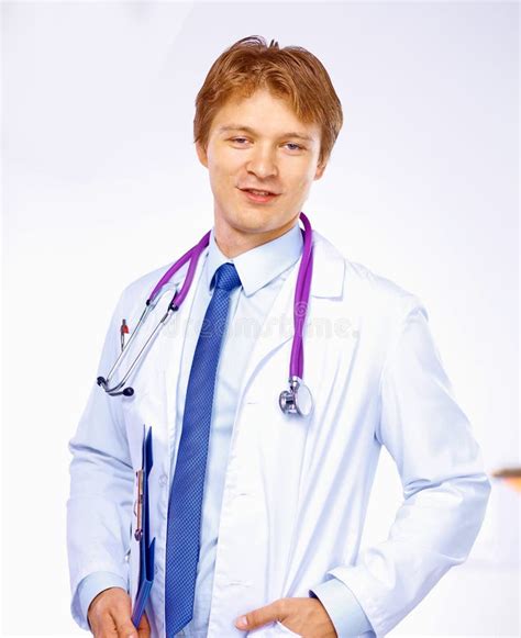 Portrait Of Confident Young Medical Doctor On White Background Stock