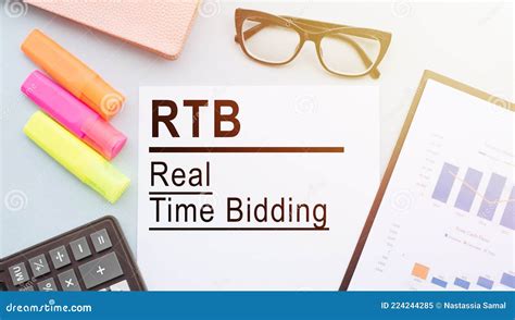 The Text Rtb Real Time Bidding On Office Desk With Calculator