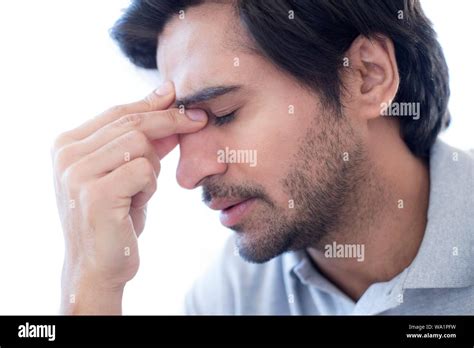 Man Pinching The Bridge Of His Nose Stock Photo Alamy