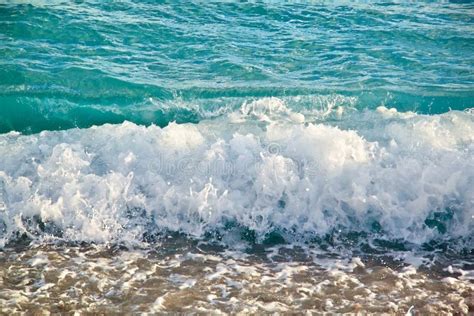 Azure Sea Waves With Yellow Sand Beach Bright Sun Light And Beautiful