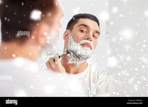 Man Shaving Beard With Razor Blade At Bathroom Stock Photo Alamy