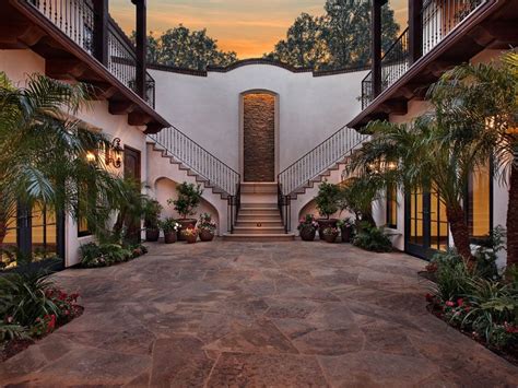 During the 1900s, when hacienda homes were further popularized by the colonial revival movement, many homebuilders chose to build their houses with traditional materials, like adobe and clay, rather than utilizing them out of necessity. courtyard | Hacienda style homes, Spanish style homes ...