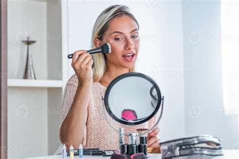 Beauty Woman Applying Makeup Beautiful Girl Looking In The Mirror And Applying Cosmetic With A