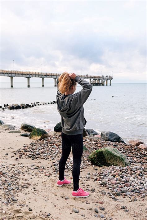 Sportive Female Standing On Shore By Stocksy Contributor Danil Nevsky Stocksy