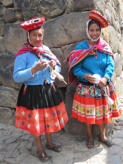 Women In Traditional Dress Knit And Stroll Through The Charming Inca Village Of Ollantaytambo