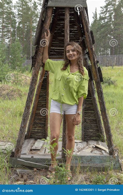 Beautiful Russian Girl At The Cottage In The Village Stock Image