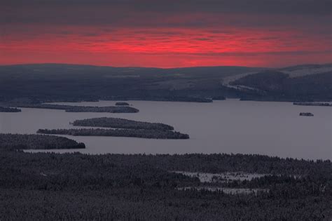 Lapland Red A Flaming Red Sunrise Above The Forests And Frozen Lakes