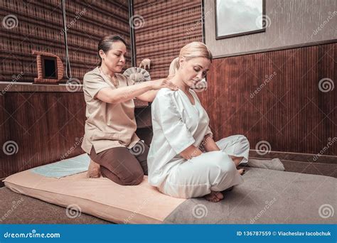 Professional Female Masseuse Massaging Her Clients Shoulders Stock Image Image Of Trip