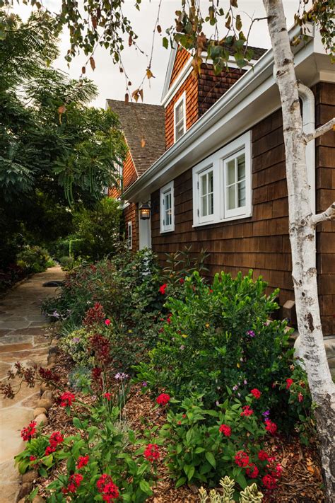 Flowering bushes are a wonderful splash of color to your landscape. Flowering Bushes Serve as Natural Wall for Two-Story ...