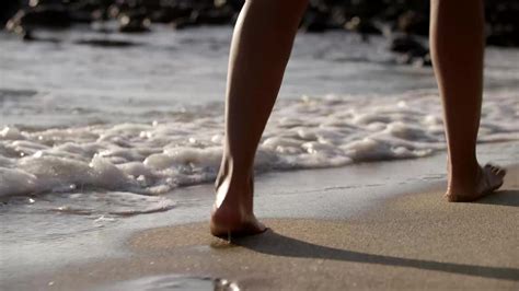 Woman Walking Along The Beach Filmpac