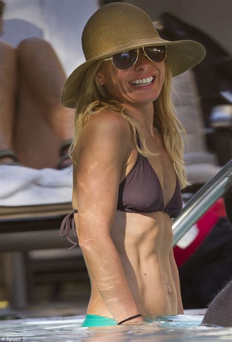 Kelly Ripa gives a cheeky flash of her pert derrière as she hits the