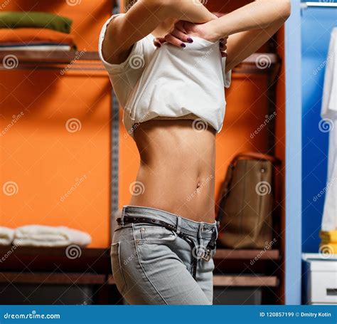 Young Woman Take Off Her T Shirt In Wardrobe Stock Image Image Of Fashion Girl 120857199