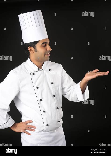 Cooking Profession And People Concept Happy Male Indian Chef In Toque With Ladle Showing