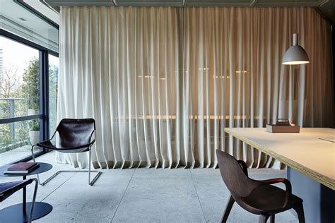 This Spacious And Inventive Office In Brazil Uses Drapes To Delineate Space