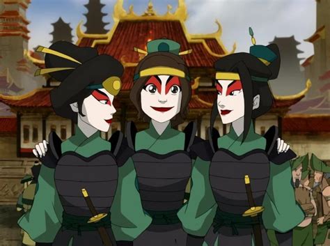 Three Geisha Standing Next To Each Other In Front Of A Building