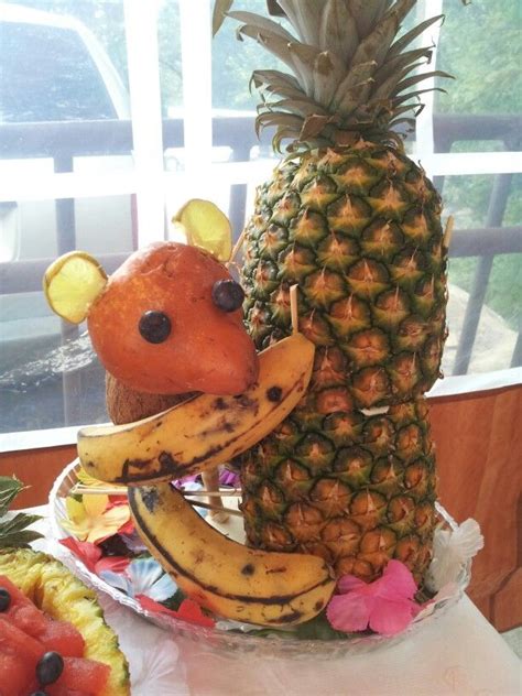 As the tree matures, the ridges on the bottom of the trunk start to look like folds. monkey on a palm tree fruit carving, hawaiian luau party ...