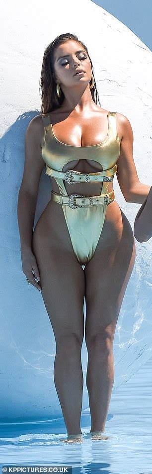 Demi Rose shows off some serious underboob and her pert bottom in a very skimpy gold lamé
